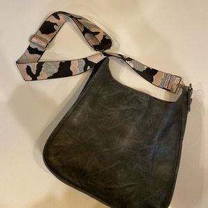 Grey faux-leather purse with interchangeable strap.